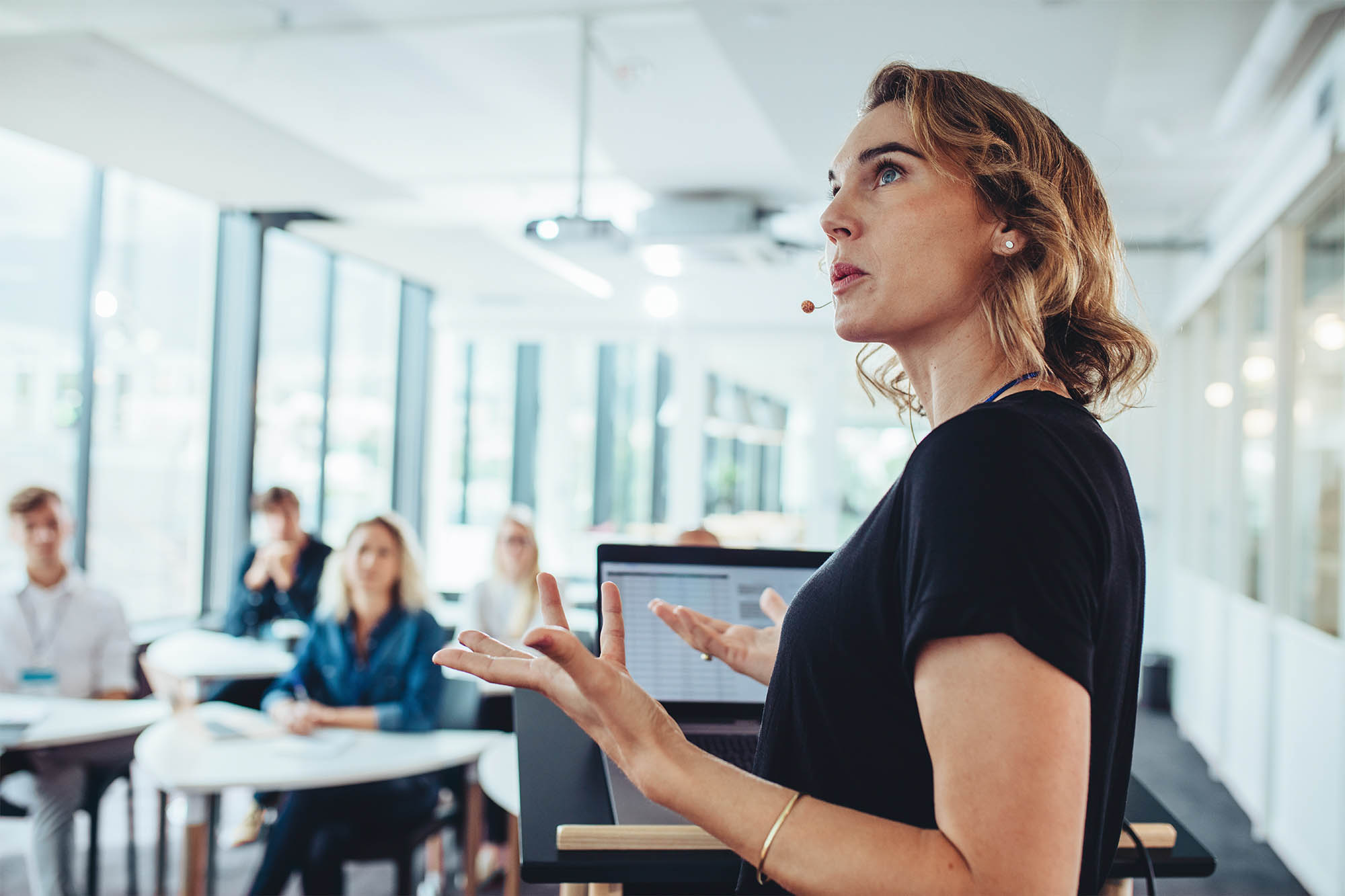 Businesswoman delivering a presentation at a conference. Female entrepreneur sharing new business ideas in a conference.